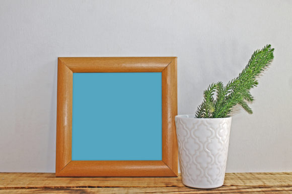 Blank Frame on a Shelf with a Decorative